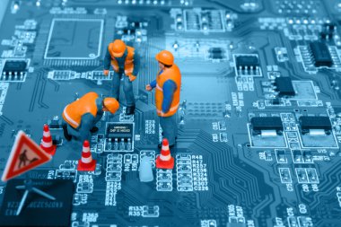 depositphotos_7960841-stock-photo-miniature-engineers-fixing-error-on